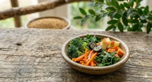 A bird-safe salad bowl containing chopped carrots, broccoli, leafy greens, and apple pieces.