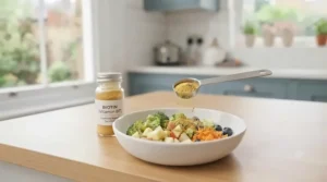 Owner mixing a daily powder feather health supplement into a bowl of fresh fruit and vegetables for a pet parrot.